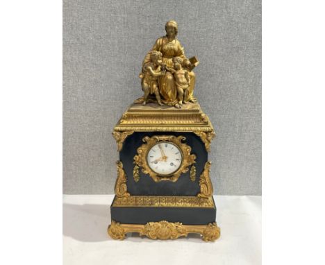 A 19th Century French ormolu and black marble mantel clock, silk suspension, figural scene to top 