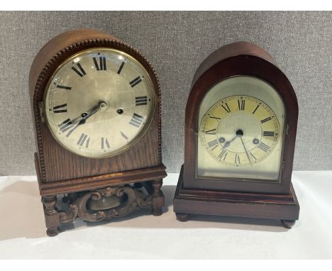 Two early-mid 20th Century arched top clocks, one in oak with beaded surround, the other mahogany, both with pendulums 