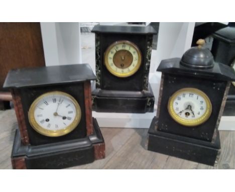 Three early 20th Century black slate and marble mantel clocks, one with chipped enamel dial, the other with chipped marble, t