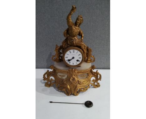 A Caillaud French ormolu mantel clock with two train movement, Roman numerals, face cracked, 40cm tall x 32cm wide, with pend