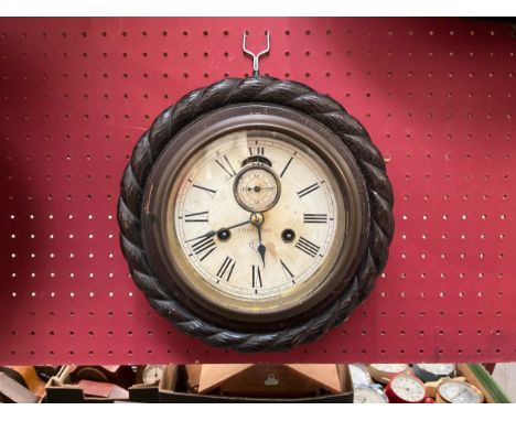 An Ansonia Clock Co. ship's clock, 8 day movement, oak rope twist case, 23cm diameter 