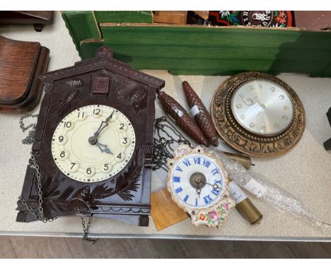 A Bakelite cased cuckoo clock, made in USSR, together with a Metamec wall clock and a Continental porcelain faced alarm clock