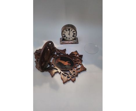 A 19th Century fretwork miniature wall bracket with base metal travel clock, glass loose 