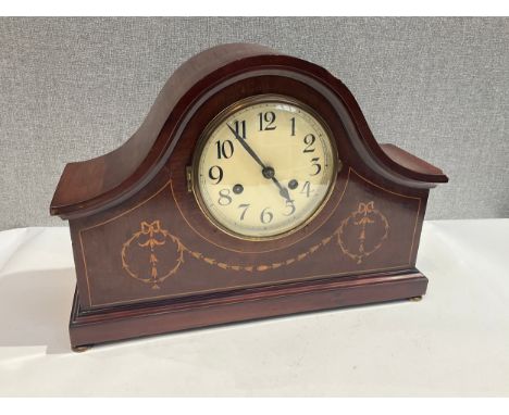 An Edwardian mahogany inlaid mantel clock, Arabic dial, some damage, with pendulum 
