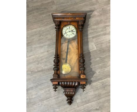 A 19th Century Vienna wall clock with two train movement, striking on a gong, some case damage, 116cm tall x 46cm wide, with 