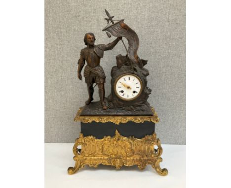 A late 19th Century mantel clock, the bronzed spelter top with flag bearer beside enamelled face (damaged) upon an ormolu, ti