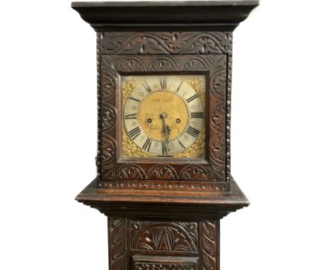 A Daniel Daulton of Church Lawford long case clock with heavily carved possibly later oak case, gilt fretwork mounts, gilded 