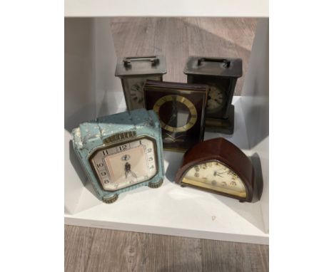 A quantity of compact timepieces including Deco tin cased 