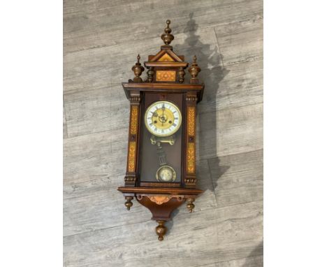 A circa 1900 Vienna style wall clock with decorative painted columns and panels, with pendulum 
