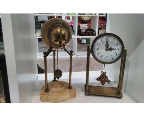 A Nathan &amp; Co. Of Birmingham four pillar clock, 22cm tall, together with a mystery globe timepiece with Arabic numerals, 