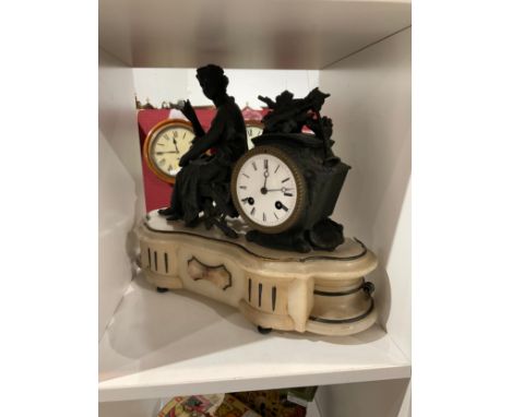 An early 20th Century alabaster and spelter mantel clock with figural design, with key and pendulum 