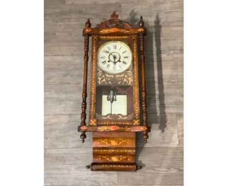 A Victorian drop dial wall clock with blind fret detail, Roman numerated painted dial, 99cm tall x 39cm wide, with pendulum 