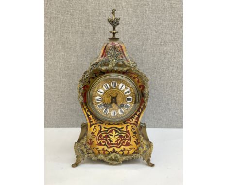 A late 19th / early 20th Century French Boulle work mantel clock with porcelain numerals, gilt brass face, Harrods retailed, 