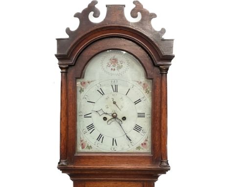 A George III oak cased long case clock with fretwork top over a painted enamelled dial, second subsidiary and calendar wheel,