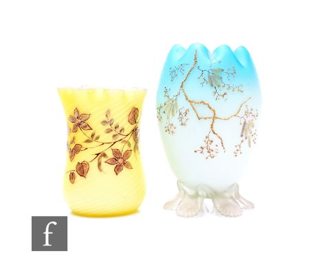 A late 19th Century spiral airtrap satin cased glass vase, swollen form with drawn fluted neck, gilt enamelled with flowering