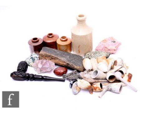 A collection of 19th Century clay pipe bowls, assorted ink pots, rock specimens and a piece of fossilised bone and a&nbsp;col