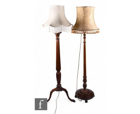 An early 20th Century reeded mahogany standard lamp and shade, reeded pedestal on splayed tripod legs, and a later similar st