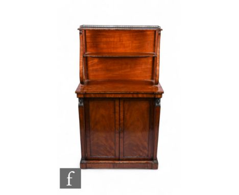 A late Regency period mahogany chiffonier of small proportions in the Egyptian taste, with two tier brass galleried upright s