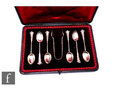 A cased set of six silver fancy handled silver teaspoons and sugar tongs.