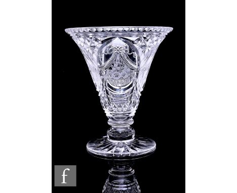 A 20th Century Stourbridge intaglio cut and engraved glass vase by Jack Lloyd, of trumpet form, on short knopped stem and cir