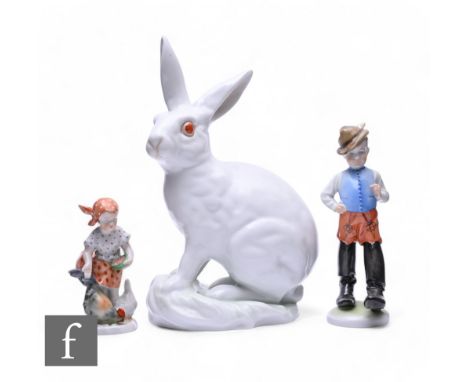 A Herend Hungarian porcelain rabbit, modelled sitting with perked ears, white glazed with salmon pink eyes on green washed na