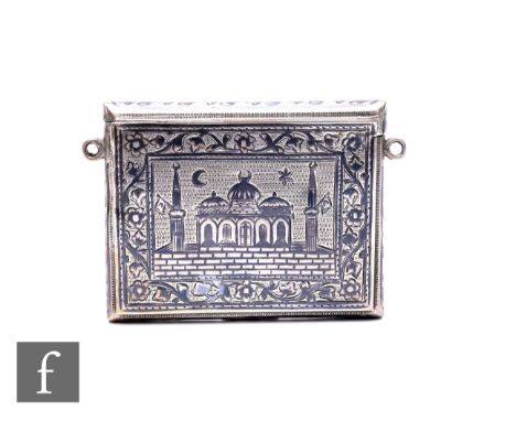 A 19th Turkish Ottoman silver and Niello decorated card case with sliding top decorated with a panel depicting a palace and a
