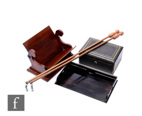 A Victorian mahogany book trough, with carved scroll supports on square base, width 28cm, together with a Parkins &amp; Gotto