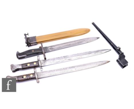 A pair of English MKII bayonets, a spike bayonet and scabbard and a US army patent bayonet and scabbard, 25cm blade. (4)