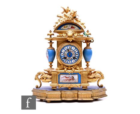 A Louis XV style French gilt mantle clock, eight day striking movement, the Sevres style circular painted dial flanked by a p