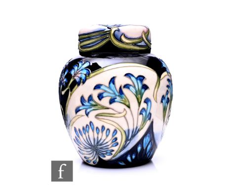 Philip Gibson for Moorcroft Pottery, a Midnight Blue ginger jar and cover, circa 2002, tubeline decorated with Agapanthus flo