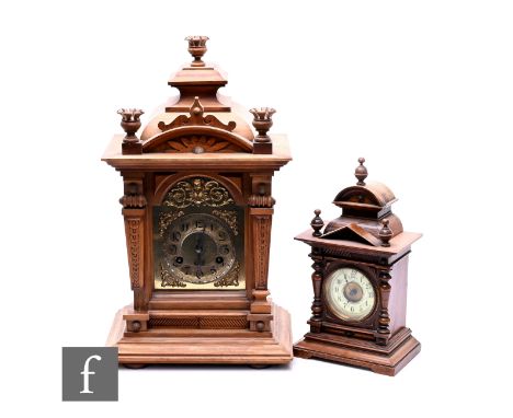 A late 19th Century walnut cased mantle clock, eight day striking movement enclosed by a glazed door on stepped base, height 