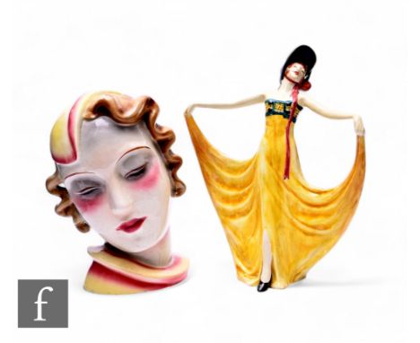 A German ceramic Art Deco bust portrait of a lady, with yellow crescent hat, blonde curls and collared dress, impressed no.56