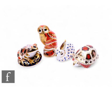 A Royal Worcester Connoisseur collection tawny owl candle snuffer, height 11cm, together with three Royal Crown Derby Paperwe