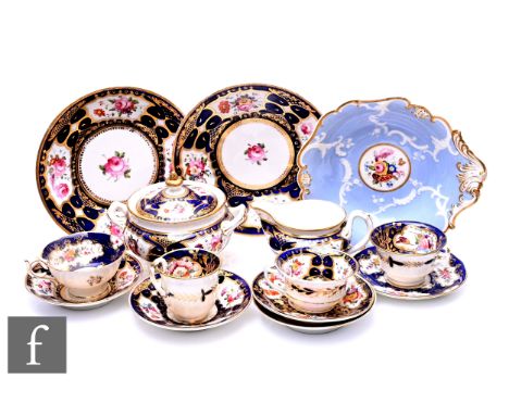 A pair of early 19th Century English porcelain plates, in the manner of Mintons or Derby, circular rose painted panel within 