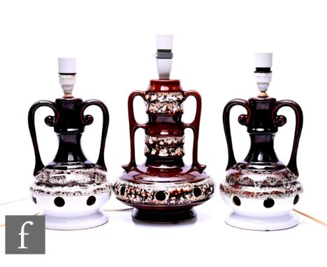 A German mid-Century fat lava lamp base, compressed globe and shaft form with twin loop handles, volcanic reticulated bands w
