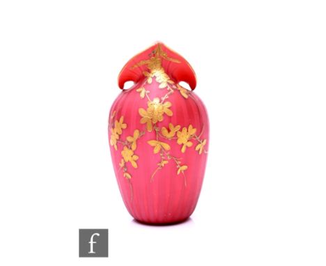 A late 19th Century Walsh (attributed) satin airtrap vase, of ovoid form with pulled arum shaped rim, gilded floral sprays ov