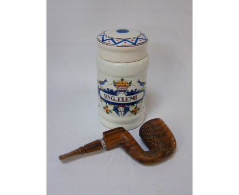 African carved wooden pipe and a delft tobacco jar