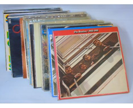 A quantity of records to include The Beatles, Rolling Stones etc