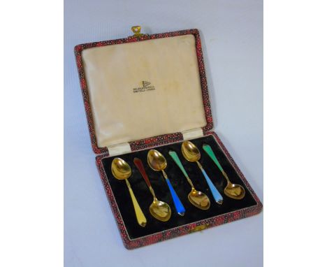 Cased set of 6 gilded silver coffee spoons with enamel handles.  Birmingham 1956