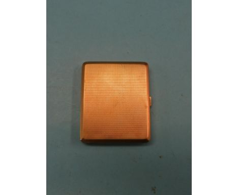 An engine-turned 9ct. gold cigarette case, 142 grams; presentation inscription