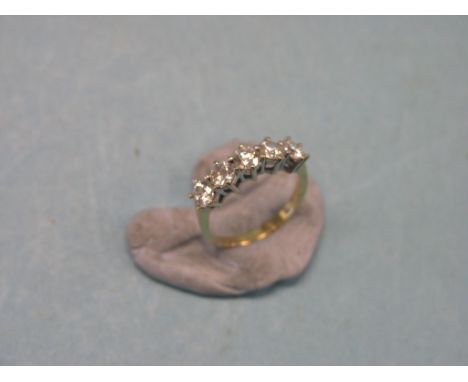 A five-stone diamond half-hoop ring, each stone approx. 0.3ct., claw settings, unmarked yellow metal shank, size N