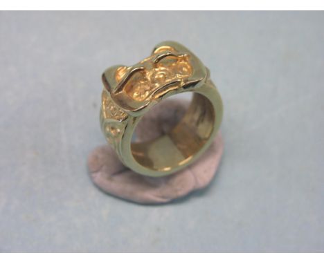 A large gentleman's 9ct. gold dress ring, 36.5 grams