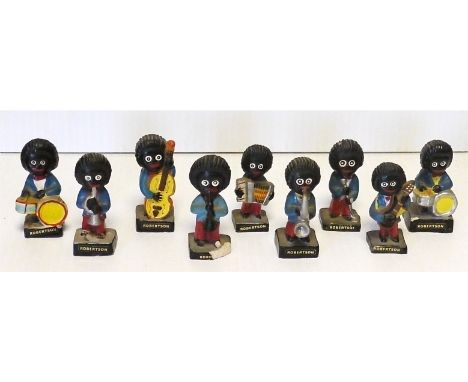 Robertson's Golly Band, nine figures playing an assortment of instruments, one broken at the base, one restored, P-G (9) 