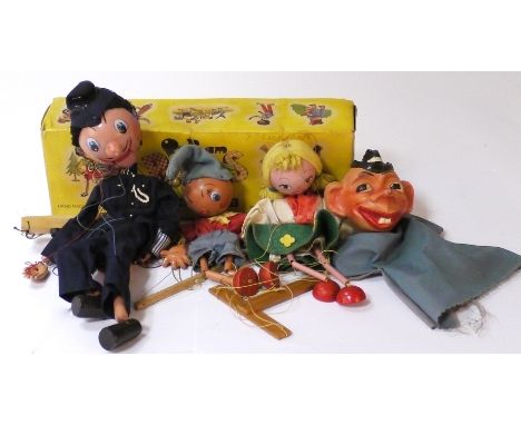 Pelham Puppets, boxed Pc11 Policeman with opening mouth, Noddy, blonde Girl with blue eyes and green skirt and a glove puppet