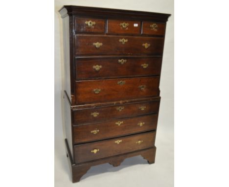 An 18th century oak tallboy,with reeded columns raised on bracket feet, width 3' 5" depth 1'9", height 5' 6"