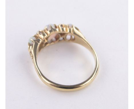An 18 ct gold opal & diamond 7 stone ring,size N
