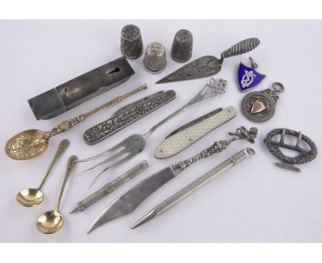 A group of silver items,including a trowel design bookmark, 2 penknives, etc