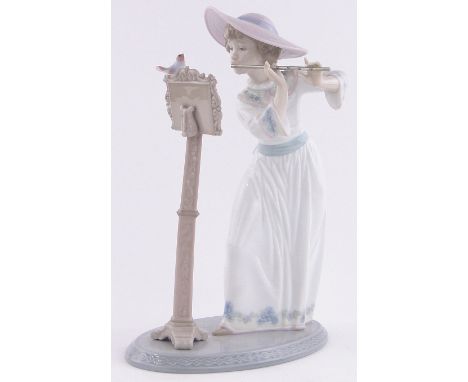 Lladro figure of a girl playing the flute,height 9.5"
