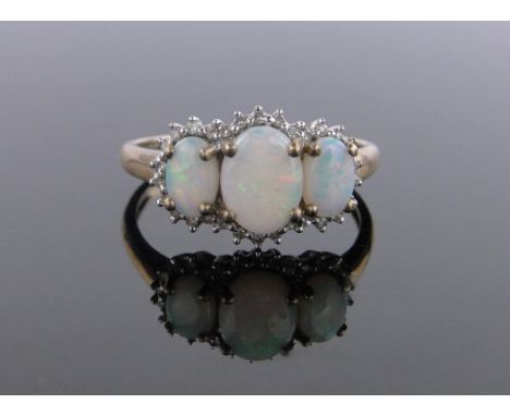 A 9 ct gold opal & diamond cluster ring,size T