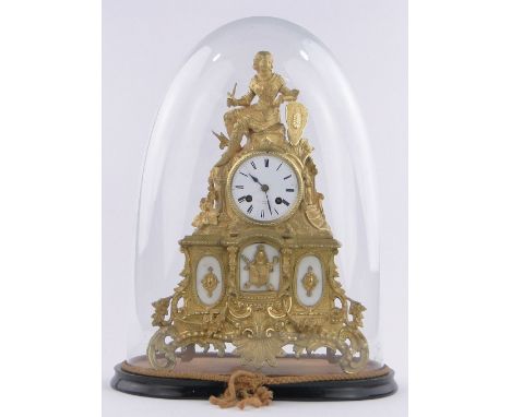 An ornate 19th century French gilt metal cased mantel clock,surmounted by a figure in armour, enamel dial signed F L Hausburg